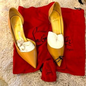 Christian Louboutin nude Kate kitten heel with extra heel tips.